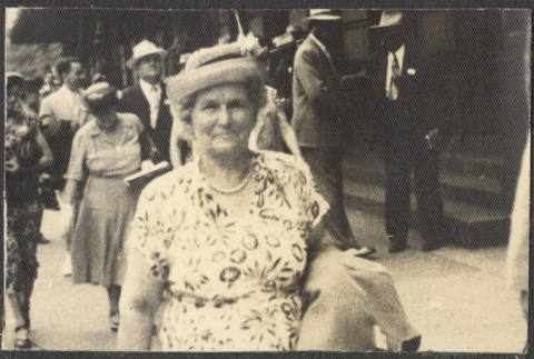 Woman walking on sidewalk (ddr-densho-523-201)