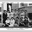 Twelve women posing for photo outside house (ddr-ajah-6-912)