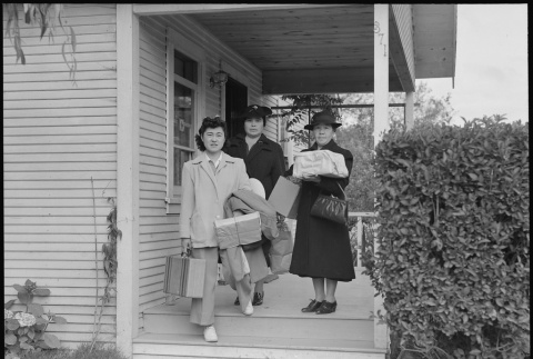 Family leaving home on day of mass removal (ddr-densho-151-182)