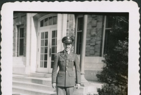 Man standing on steps of building (ddr-densho-434-471)