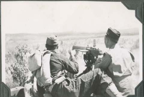 Two men with machine gun (ddr-ajah-2-96)