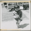A young girl holding a box (ddr-densho-338-83)