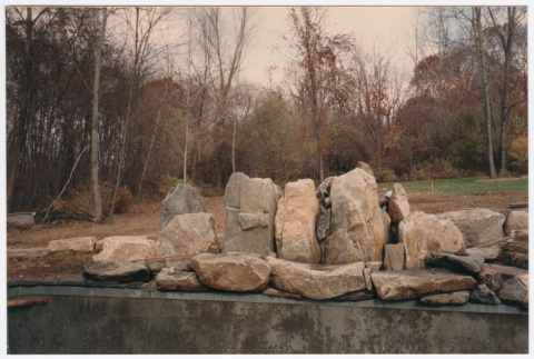 Pool with rock feature under construction (ddr-densho-377-2394)