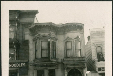 Building with car in front, possibly Henri Takahashi in doorway. (ddr-densho-426-2243)