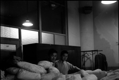 Two men with shipping bundles (ddr-densho-426-948)