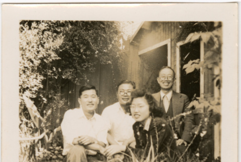 Martha (Nozawa) Tsuchida Suzuki and three unidentified men in garden (ddr-densho-426-2115)