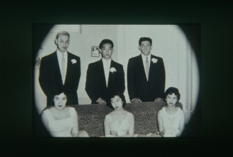 (Slide) - Image of three young men in suits standing, three young women in dresses seated (ddr-densho-330-149-master-fa8308db4a)