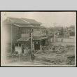 House with lumber in yard (ddr-densho-359-775)
