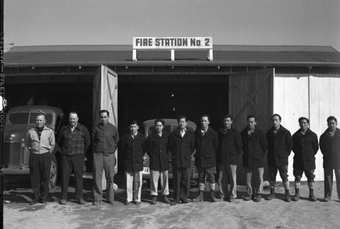 Firemen standing in front of Fire Station No. 2 (ddr-fom-1-758)
