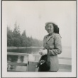 A woman standing on a dock (ddr-densho-298-273)