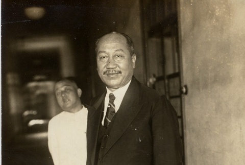 Two men standing in a hallway (ddr-njpa-1-1735)