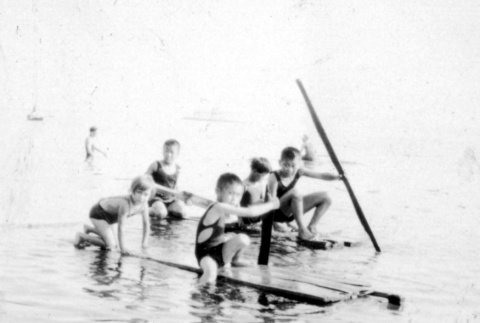 Children playing on a homemade raft (ddr-densho-12-4)