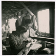 Two Japanese American boys work on a project (ddr-densho-362-19)
