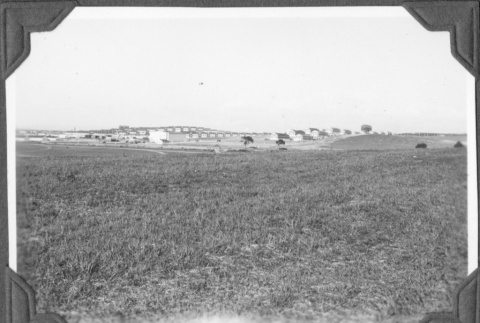 View of field with fort in background (ddr-ajah-2-40)