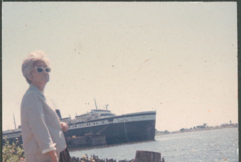 Agnes Sakura on shore with ship in background (ddr-densho-523-457)