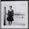 Woman behind barbed wire at Amache (ddr-densho-545-57)