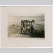 Group of women and a girl standing on beach (ddr-densho-316-189)
