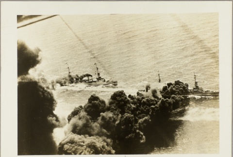 Smoke trails rising off navy ships (ddr-njpa-13-400)