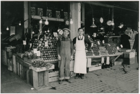 Two men in the Pacific Market at 12th and Jackson Street (ddr-densho-353-127)