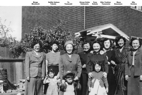 Group of women and children outside building (ddr-ajah-4-60)