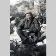 Ben Toru Yoshida eating from mess kit in snow (ddr-densho-474-227)
