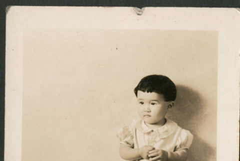 Young girl with birthday cake (ddr-densho-316-195)