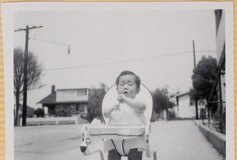 Susan Shiomi in bouncy chair (ddr-densho-522-153)