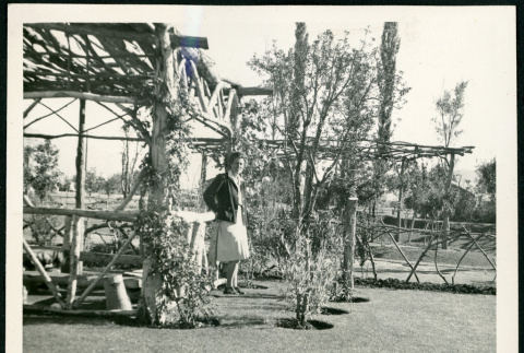 Photograph of L. Josephine Hawes standing in the Children's Village park at Manzanar (ddr-csujad-47-163)
