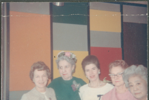 Five women by colorful wall (ddr-densho-523-459)