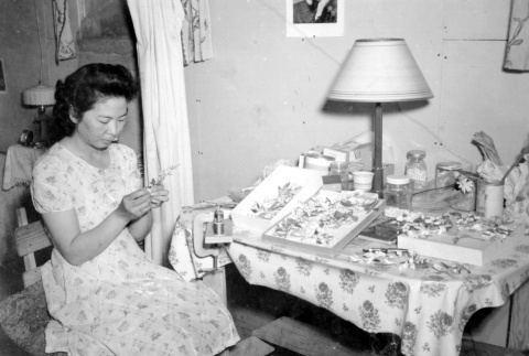 Japanese American making shell jewelry (ddr-densho-2-58)