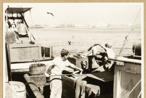 Two men working on a fishing boat (ddr-densho-542-790)