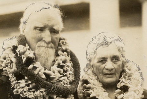A man and woman wearing leis (ddr-njpa-1-403)