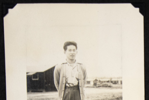 Gary Kikawa in a cardigan (ddr-densho-542-718)