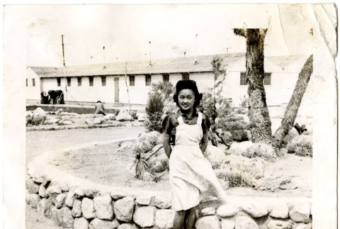 Woman in a camp garden (ddr-manz-6-21)