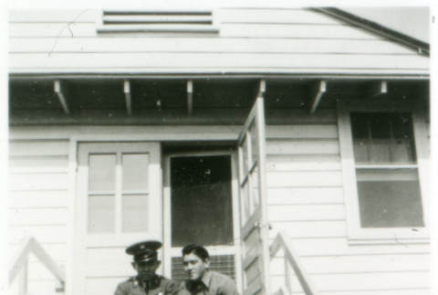 Officer and one other on stoop (ddr-densho-1007-601)