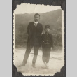 A man and boy with farmland in the background (ddr-densho-432-110)