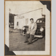 Man leaning on a fender (ddr-densho-542-158)