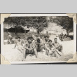 Group of men in bathing suits sitting on beach (ddr-densho-466-653)