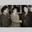 Mike Masaoka shaking hands with a man (ddr-njpa-1-969)