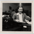 Woman seated at desk (ddr-densho-426-891)