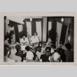 Man and woman giving cooking demonstration (ddr-densho-426-869)