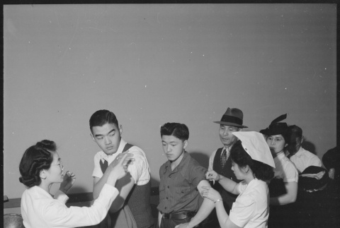 Japanese Americans receiving inoculations (ddr-densho-151-111)