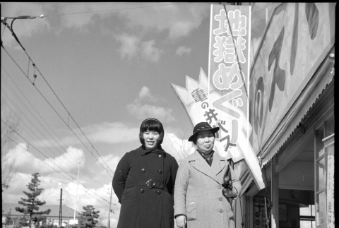 Woman and girl standing in street (ddr-densho-426-273)