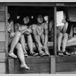 Campers sitting in a cabin window (ddr-densho-336-140)