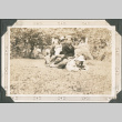 Three boys sitting on another boy (ddr-densho-316-295)