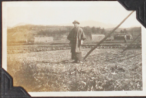 Man standing in field (ddr-densho-326-321)