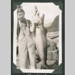 Benjamin holding large fish (ddr-densho-540-83)