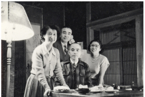 Group photo around a desk (ddr-densho-494-11)