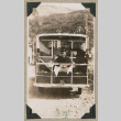 Man sitting on back of trolley (ddr-densho-383-295)