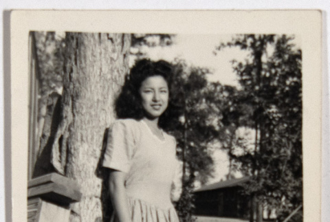 Doris Yuki leaning against a tree (ddr-densho-542-615)